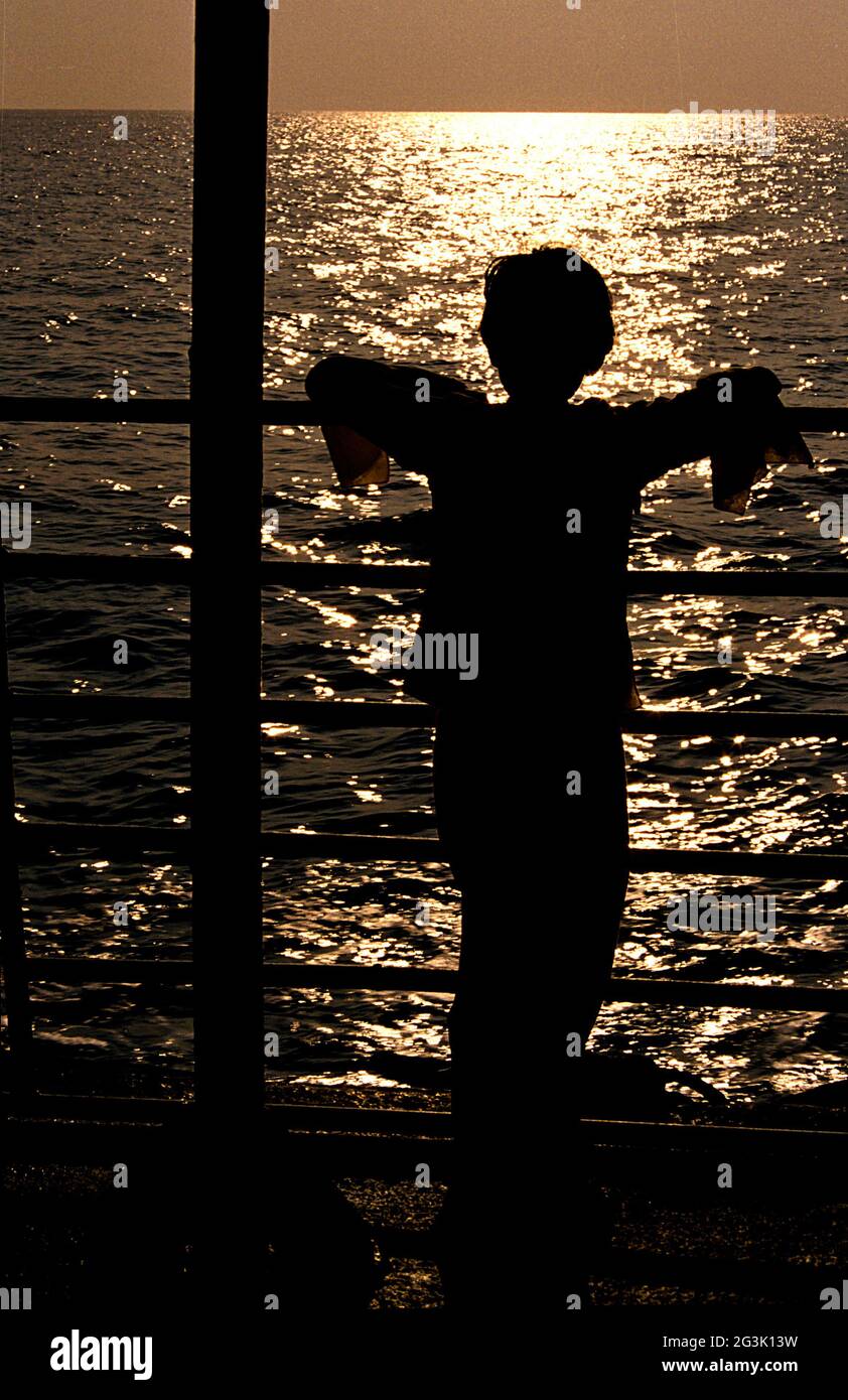 Girl watching the sunset hi-res stock photography and images - Alamy