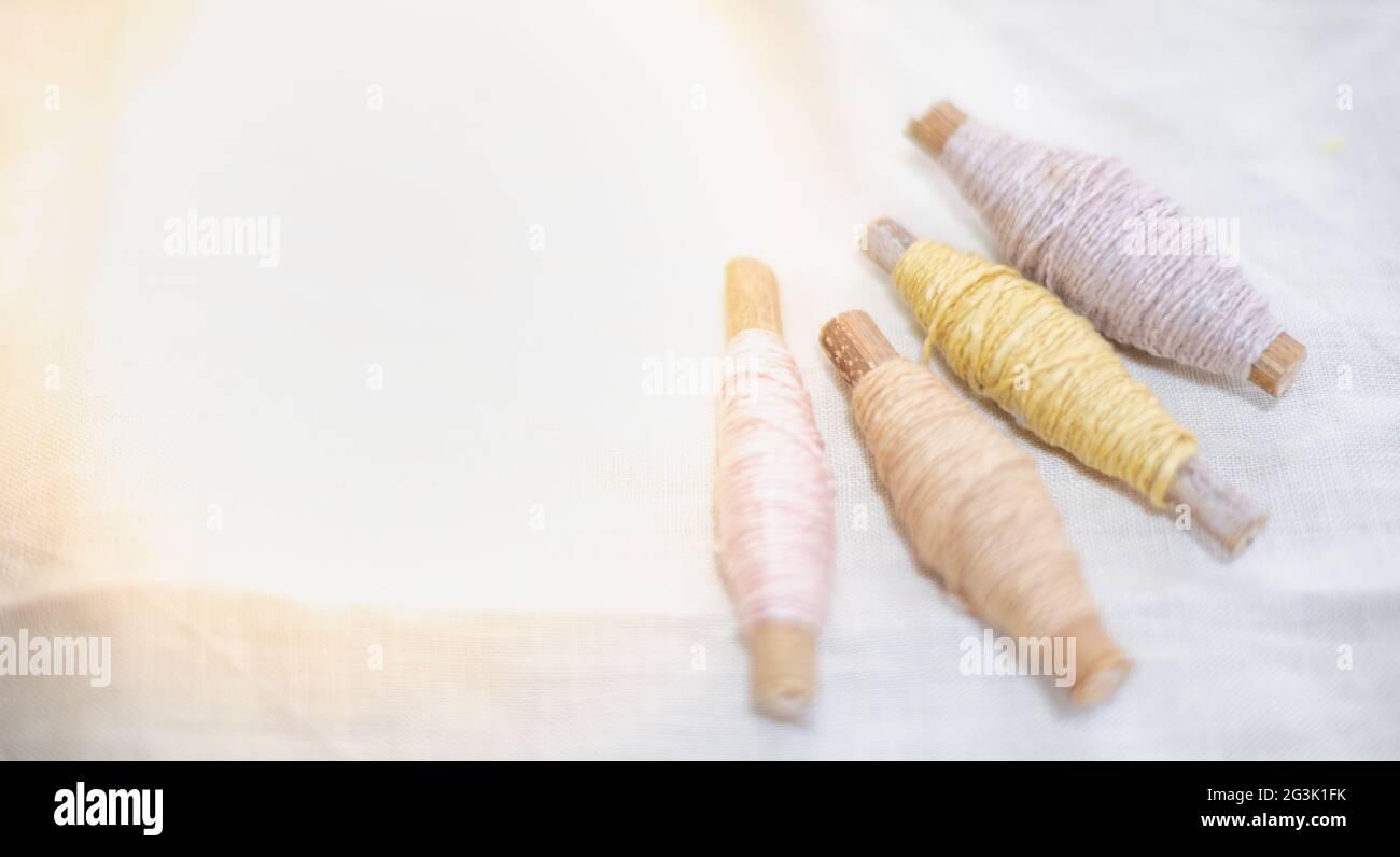 The pastel color embroidery thread roll using in the garment industry