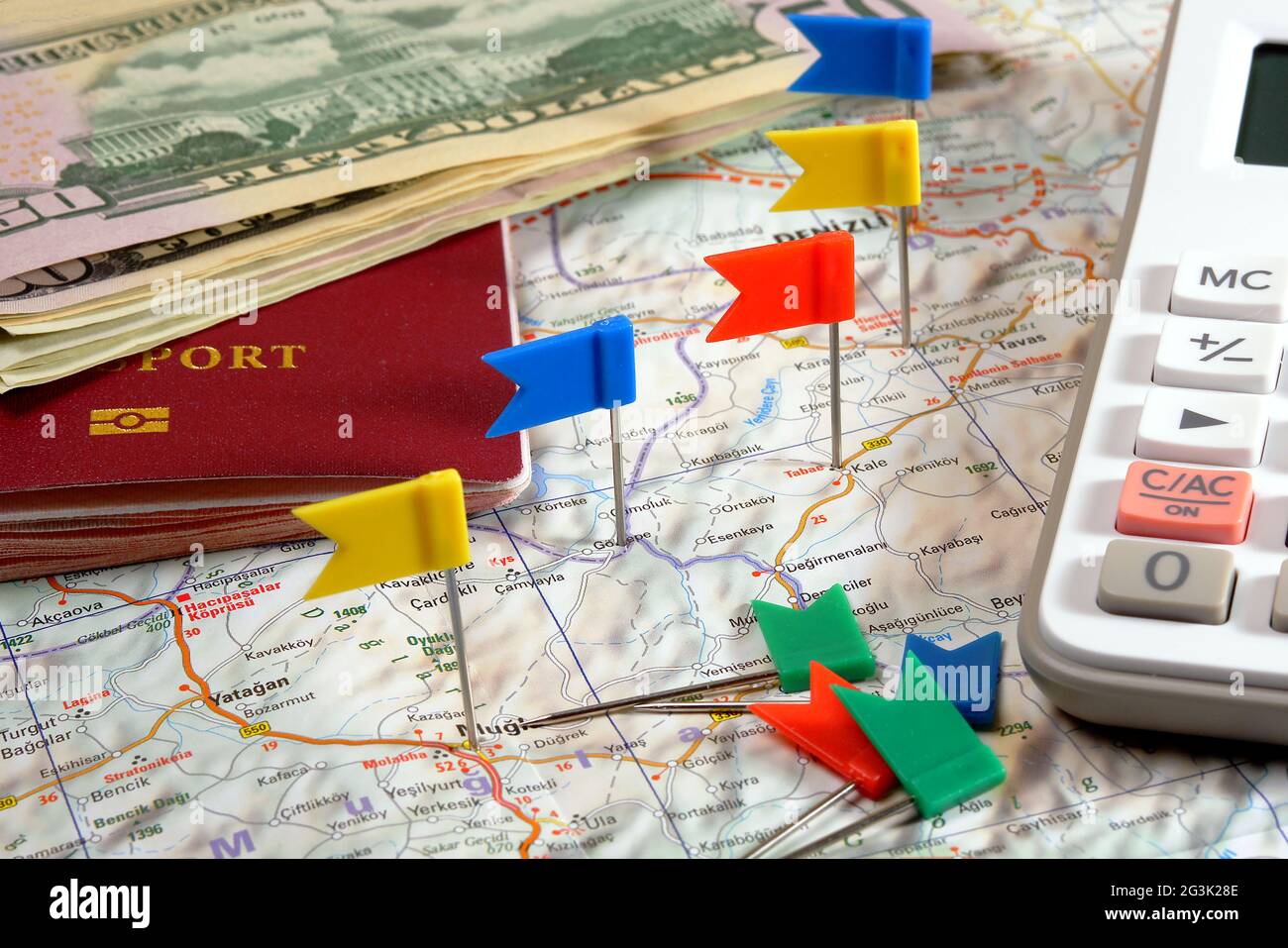 pin flags marking travel itinerary points on map and passport, dollar