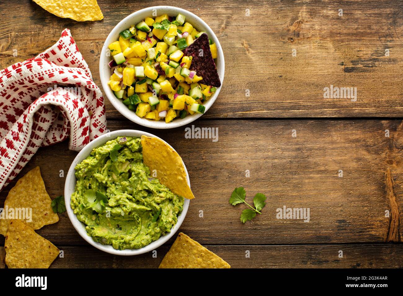 Tortilla chips with dips, guacamole and salsa Stock Photo Alamy