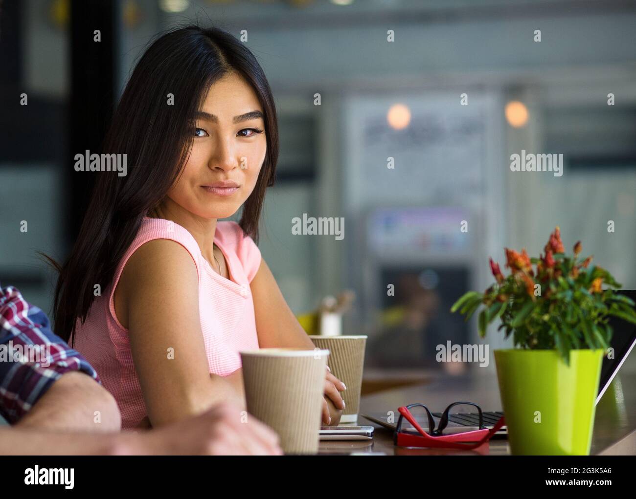 Freelance woman working in restaurant Stock Photo