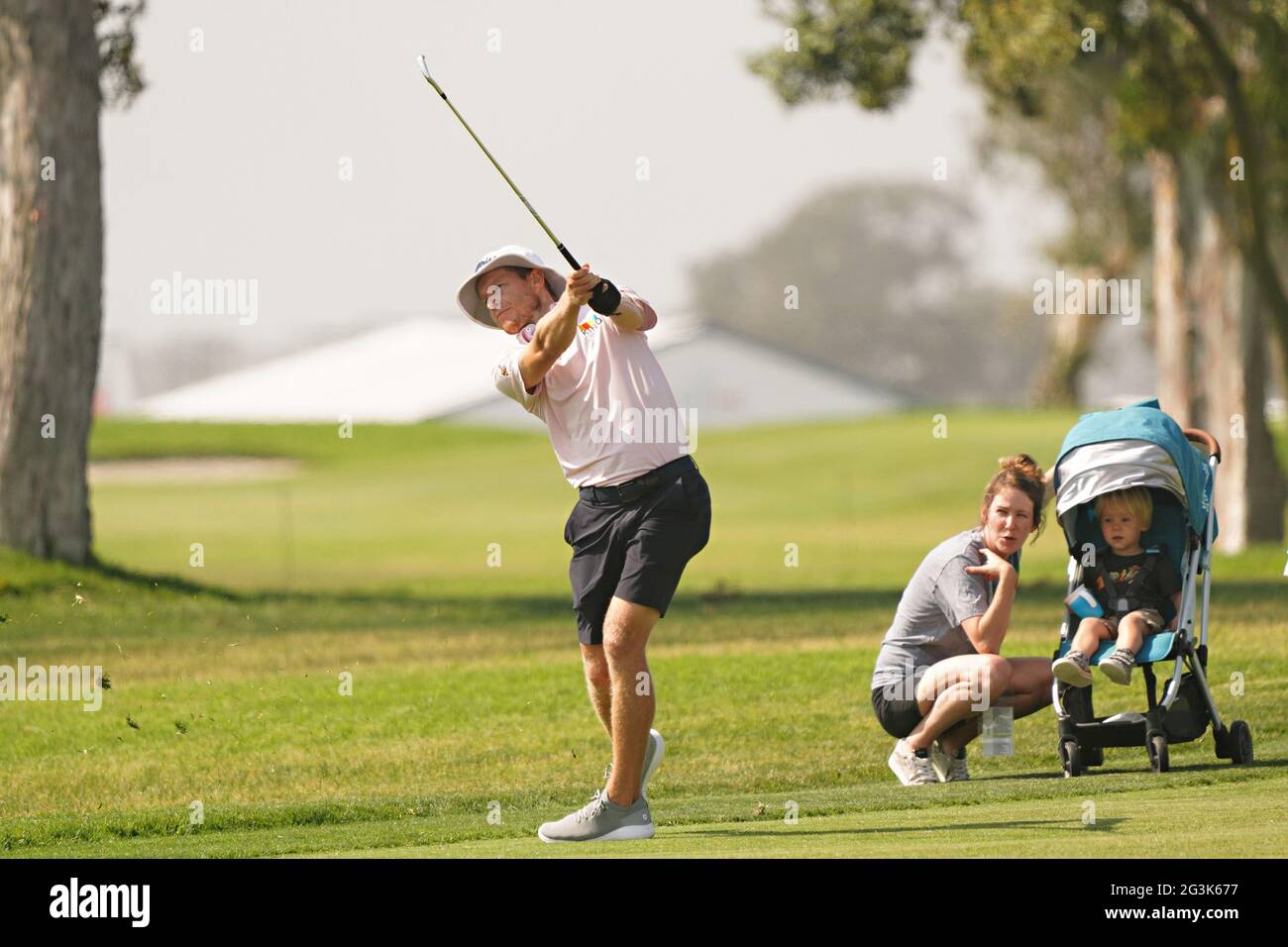 San Diego, United States. 16th June, 2021. Peter Malnati of the USA, hits a shot on the 7th green as his wife and child look on during practice day at the 121st US Open Championship at Torrey Pines Golf Course in San Diego, California on Wednesday, June 16, 2021. Photo by Richard Ellis/UPI Credit: UPI/Alamy Live News Stock Photo
