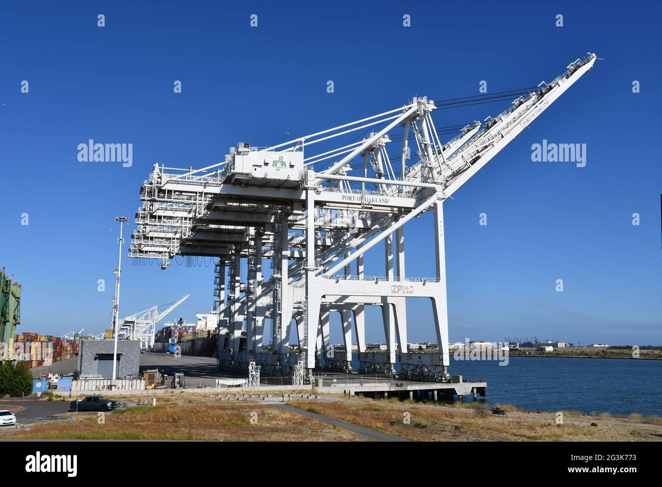 Shipping containers are loaded onto ships at the Port of Oakland