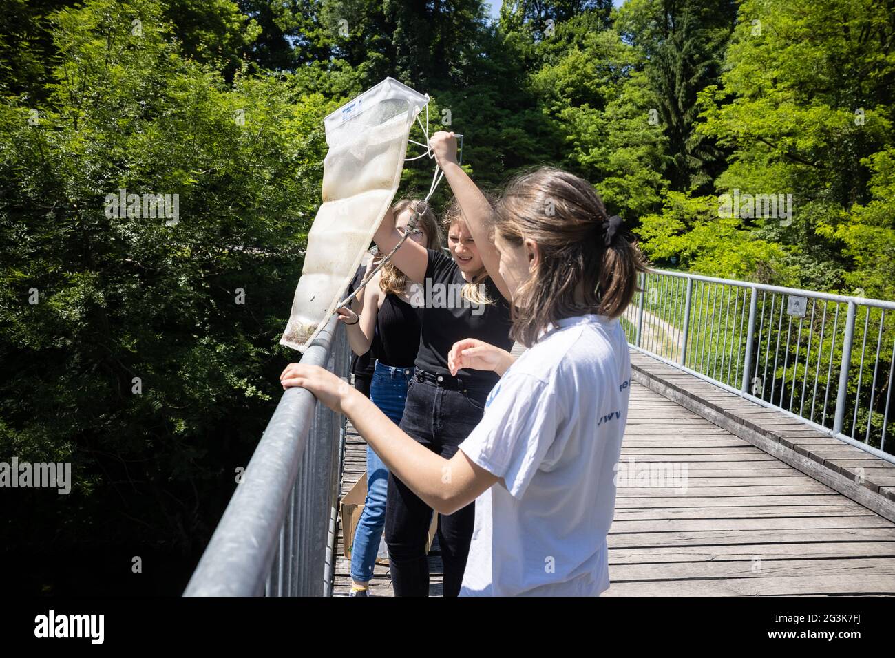 School children pull a net for collecting microplastic from the Kokra river in Kranj, Slovenia, as they participate in the Plastic Pirates - Go Europe! project.The international project Plastic Pirates - Go Europe! is an international citizen science campaign launched by the ministries of education, science and research of Germany, Portugal and Slovenia, which is taking place during their Trio Presidency of the Council of the European Union. It calls upon children and adolescents aged 10 to 16 to investigate waste, particularly plastic waste in and near bodies of water. Stock Photo