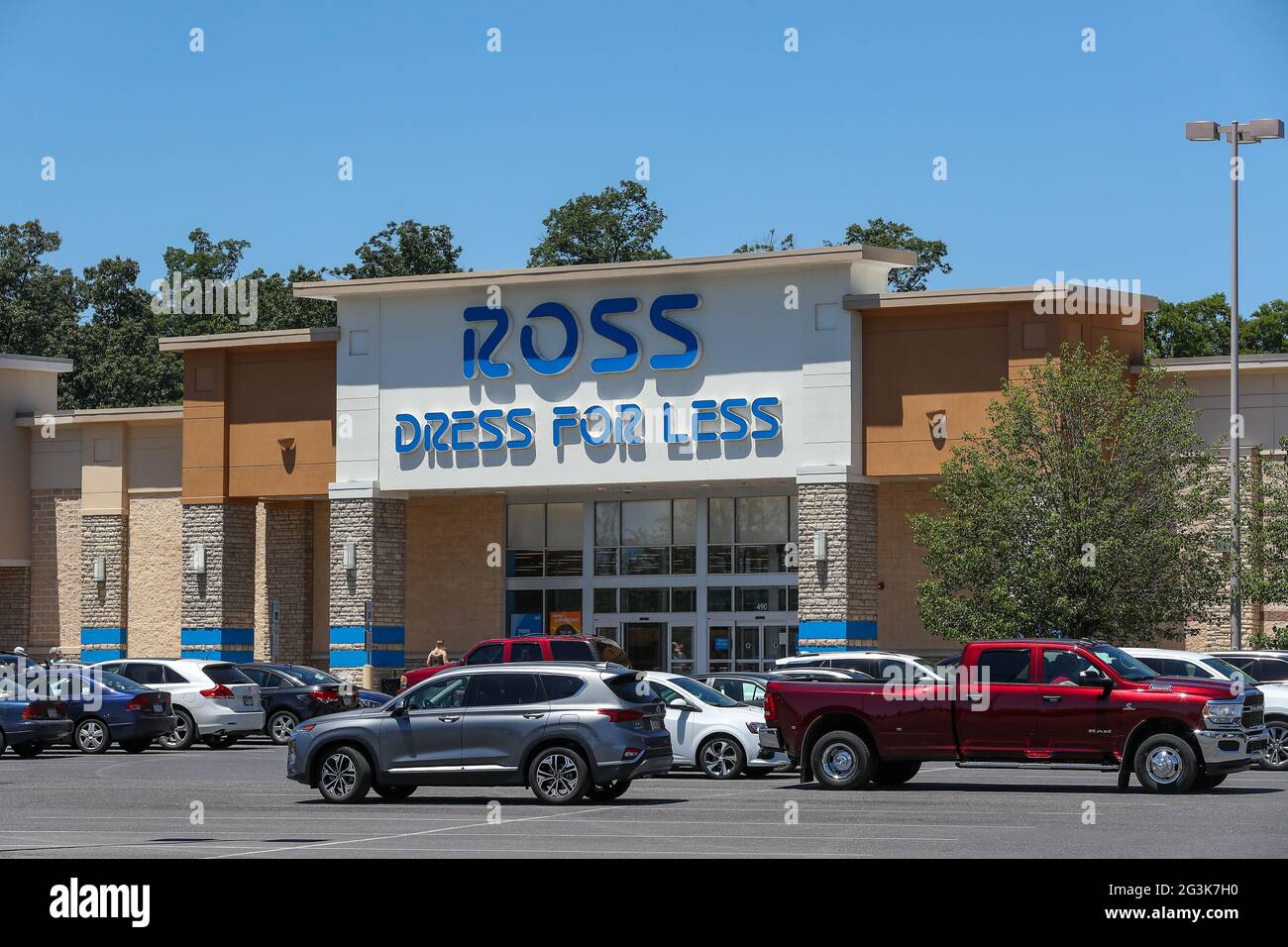 Cars are seen parked in front of a Ross Dress For Less store at