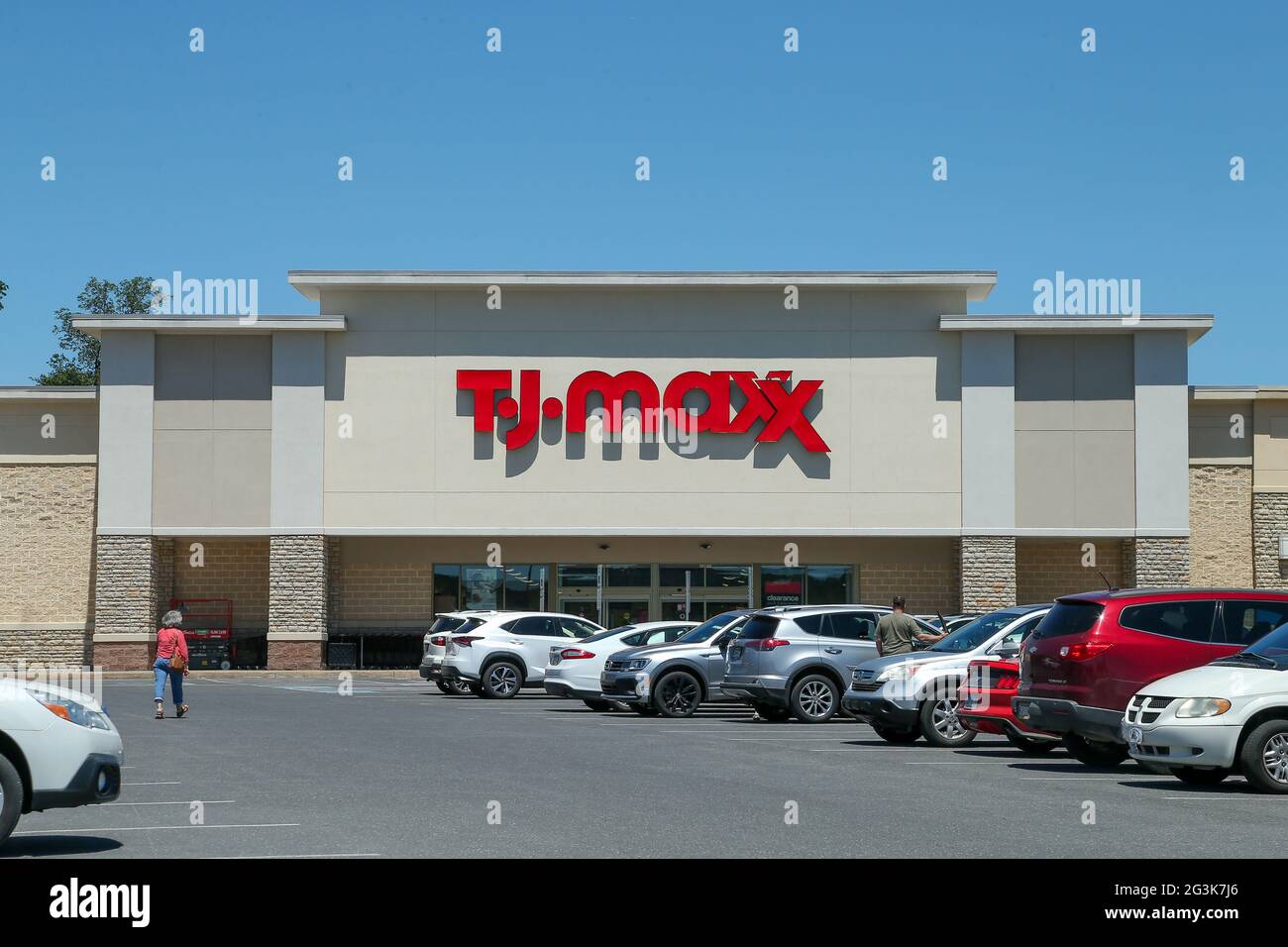 Cars are seen in the parking lot of discount department store TJ Maxx