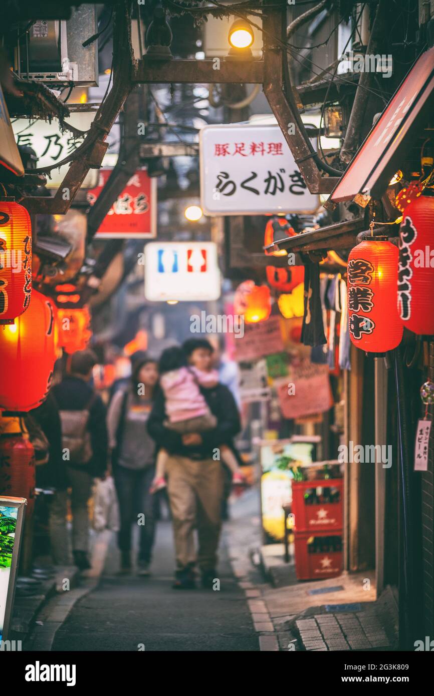 Tokyo, Japan - : Local street food alley restaurants in Tokyo, Shinjuku district with red lanterns at night. Stock Photo