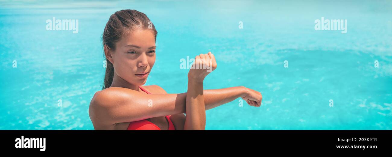 Fit Woman Stretching Arm Warm up Before Running Workout Routine On Blue Background Panoramic 