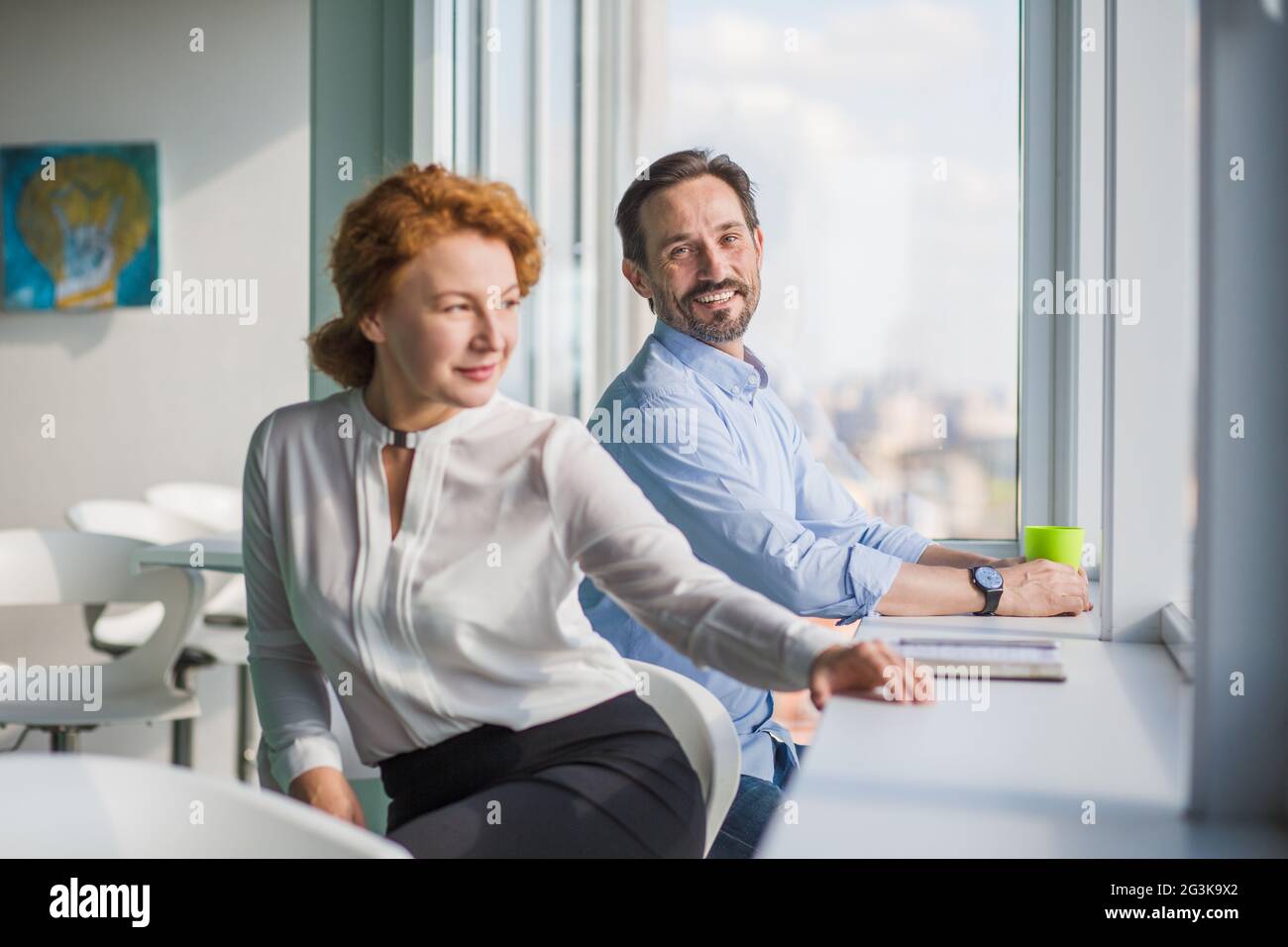 Business people having break during work in office interior Stock Photo ...