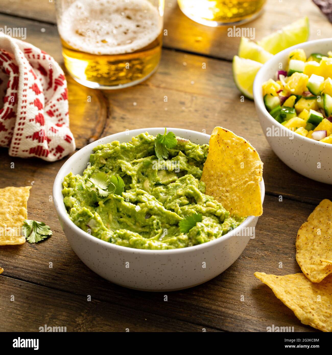 Tortilla chips with dips, guacamole and salsa Stock Photo