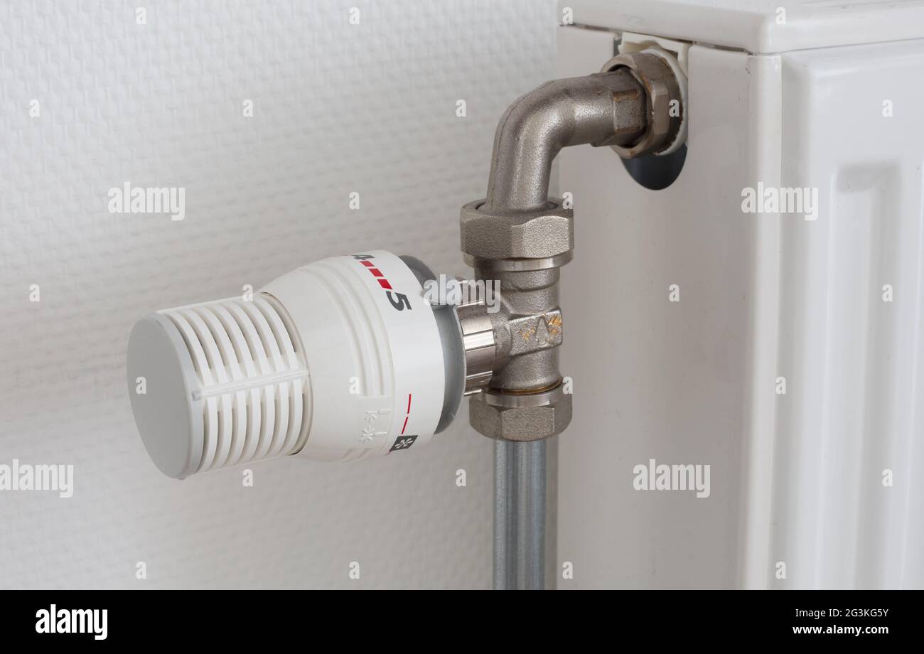 Temperature knob of heating radiator, used and dusty Stock Photo - Alamy