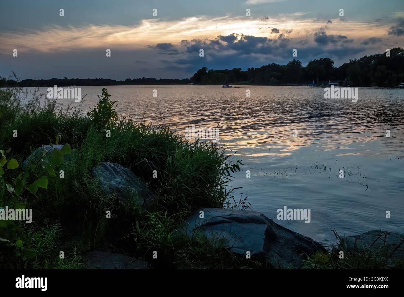 Sunset reflecting on the waters of South Lindstrom Lake at Beach Park in Lindstrom, Minnesota
