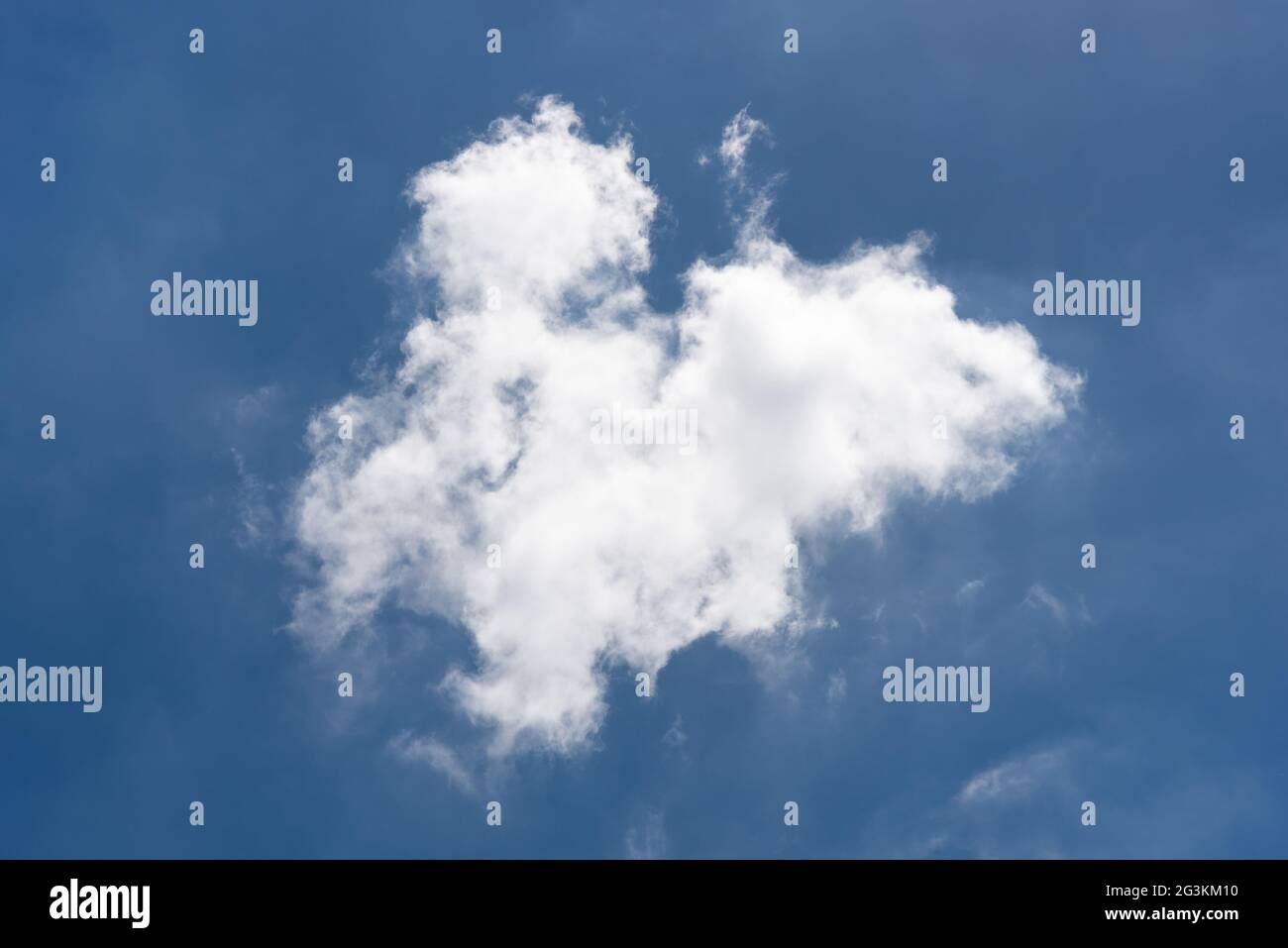 Beautiful cloudscape of nature single white cloud on blue sky background Stock Photo