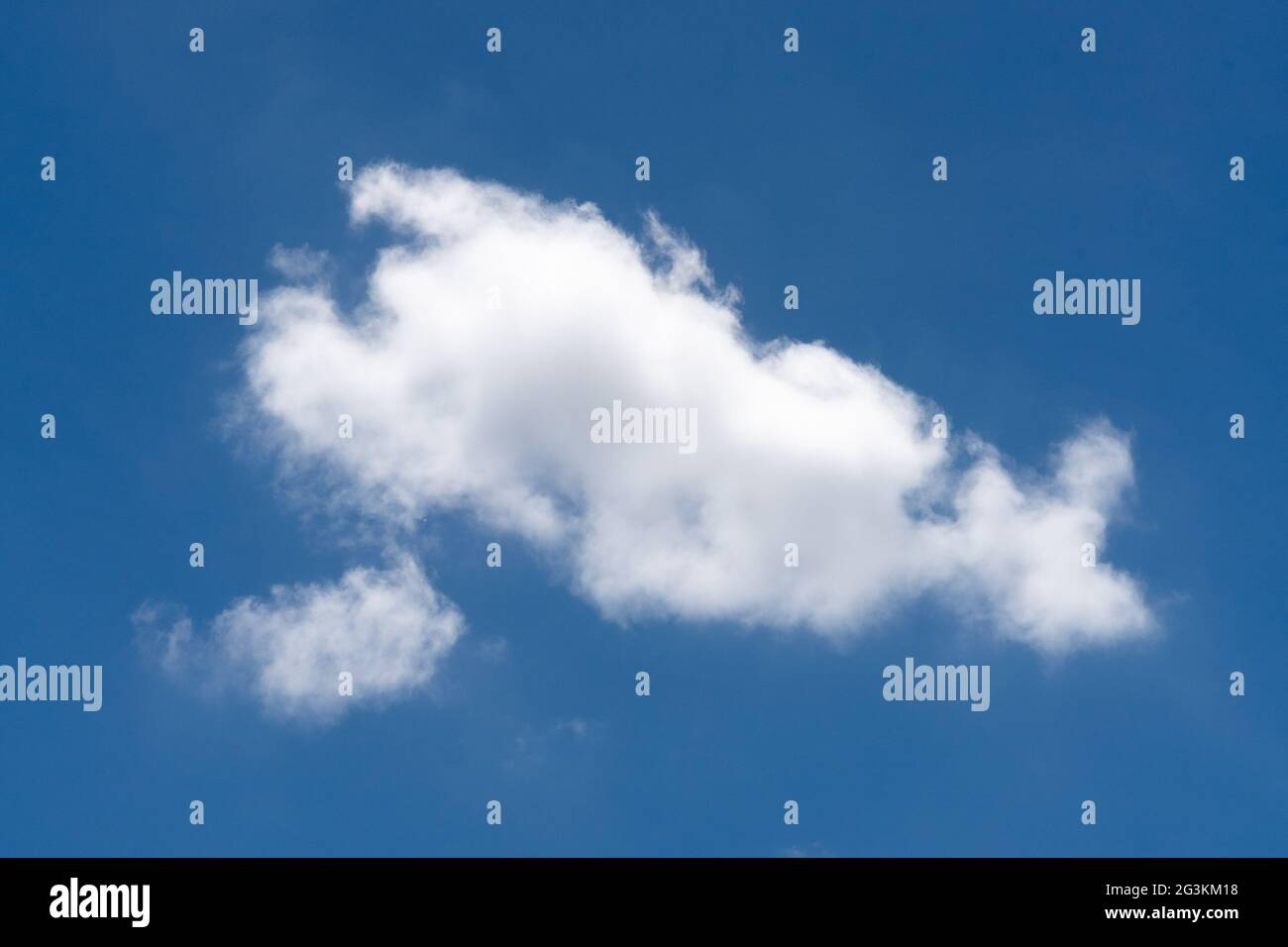 Beautiful cloudscape of nature single white cloud on blue sky background Stock Photo