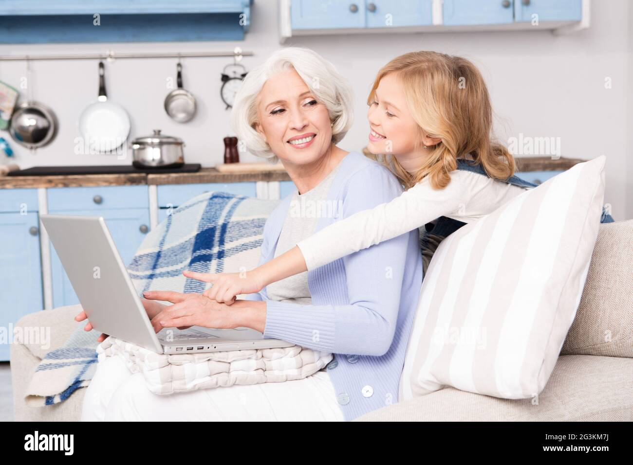Granny and little girl using laptop Stock Photo - Alamy