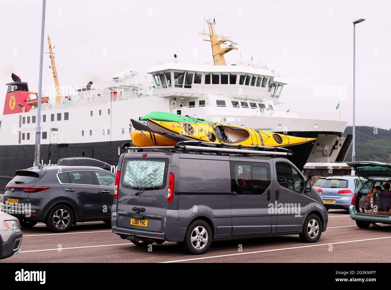 People enjoying a staycation wait to board the car ferry to take them to the Isle of Islay and other Inner Hebrides islands off Scotland's west coast Stock Photo