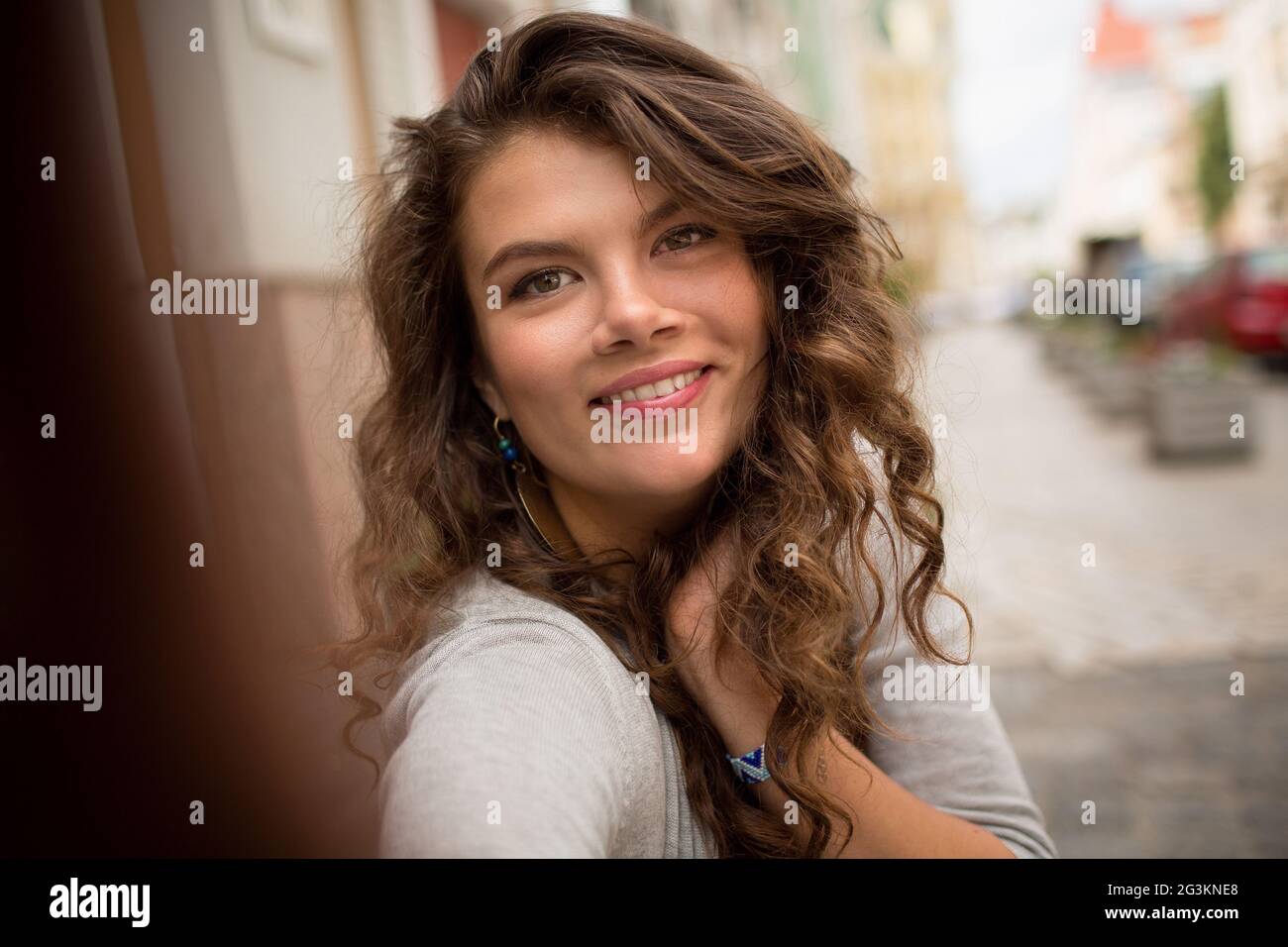 Travel girl taking selfie shot, showing emotions of happiness. Stock Photo