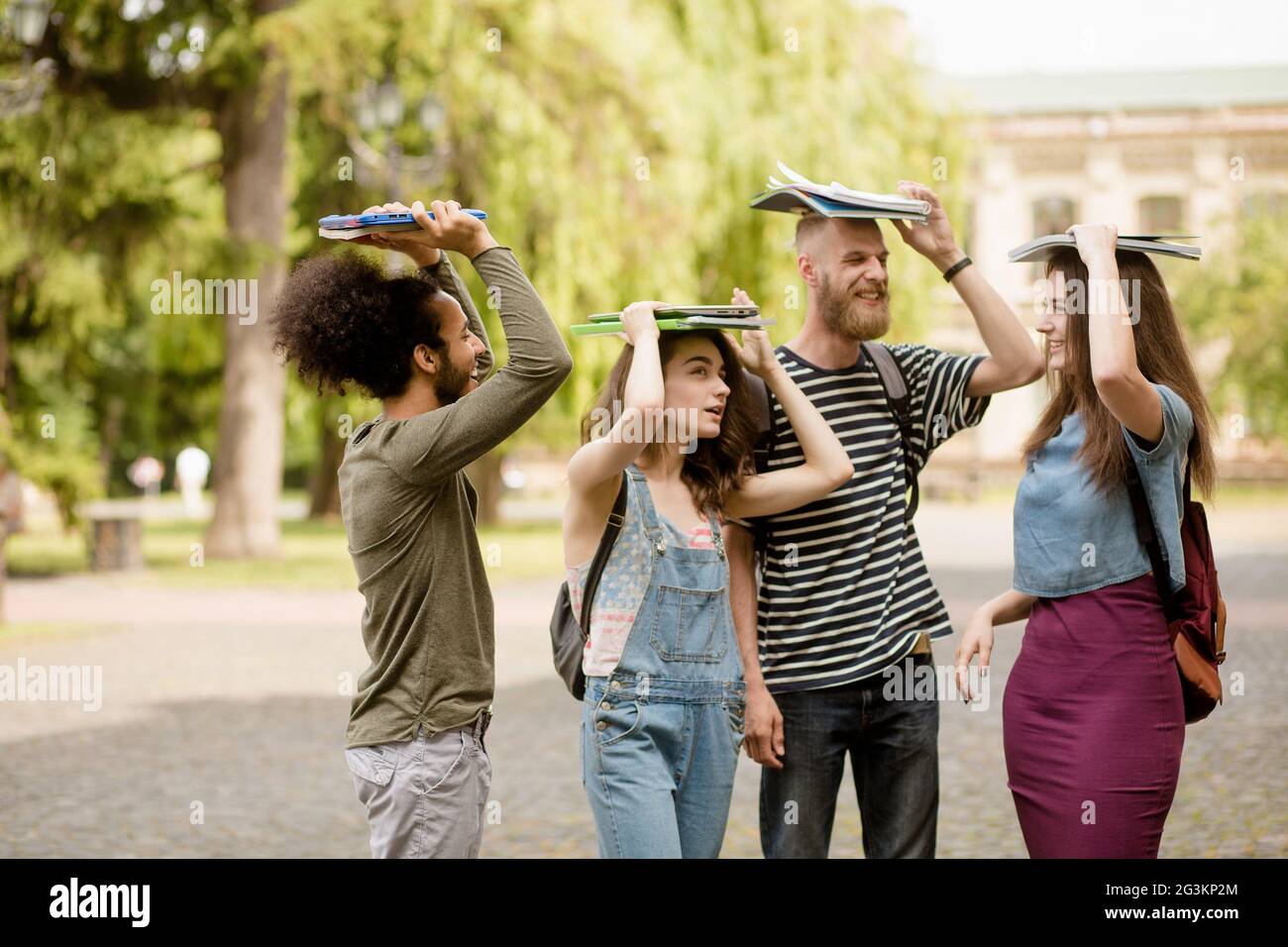 Young students fooling around in university campus. Stock Photo