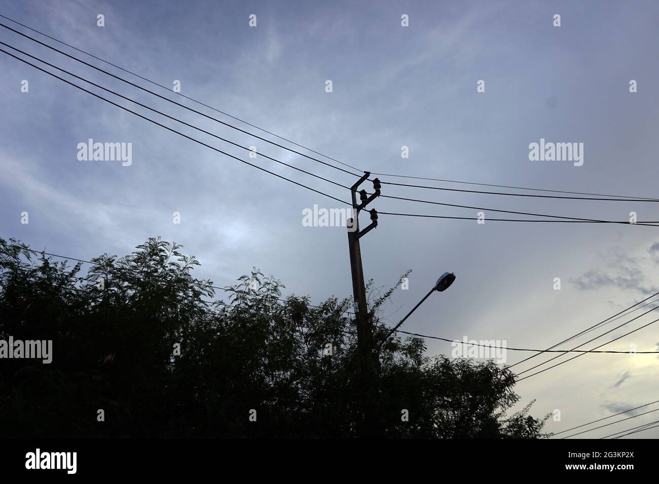 high voltage pole in blue sky white clouds background Stock Photo - Alamy