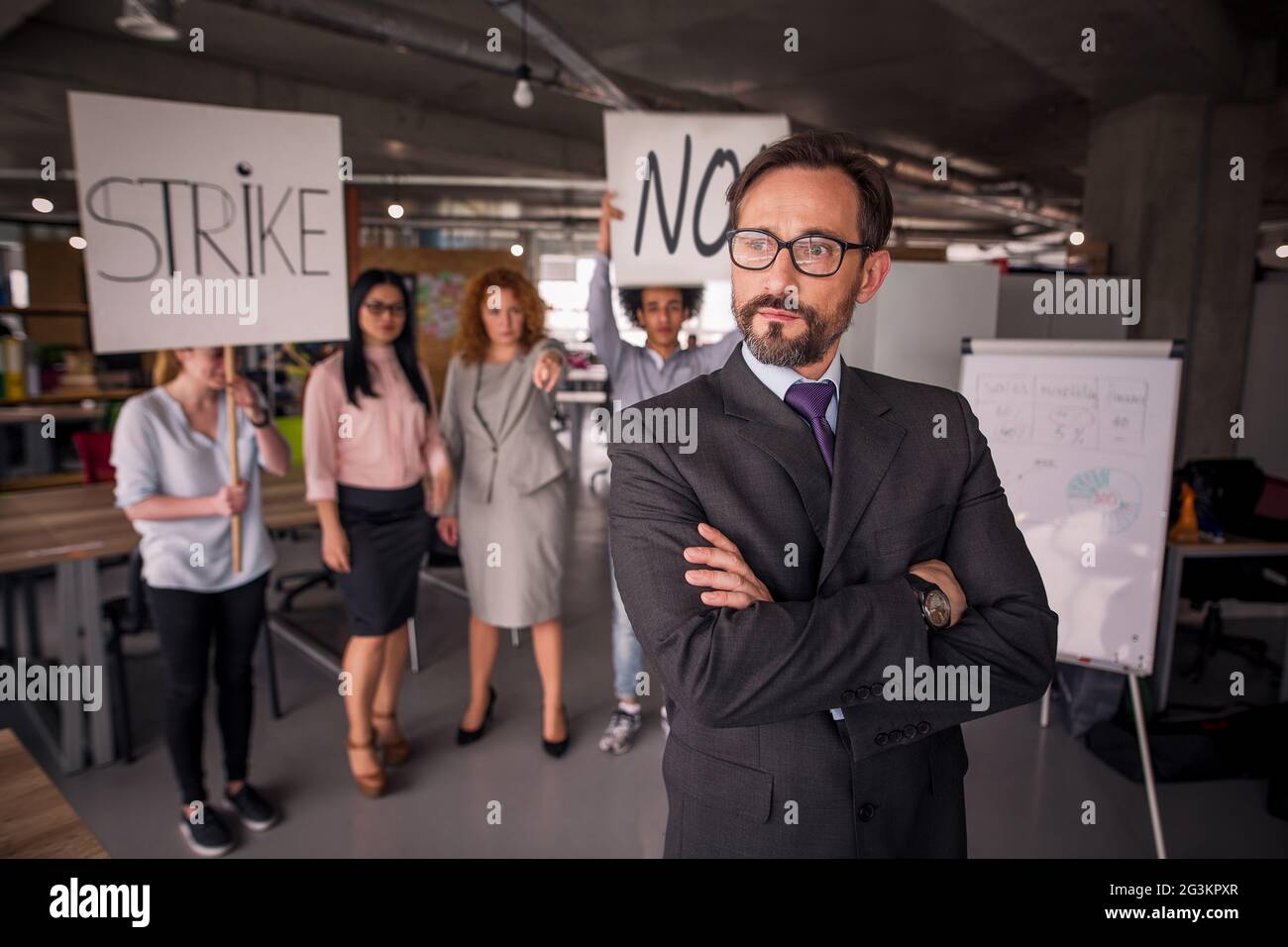 Unsatisfied employees on strike in the office. Stock Photo