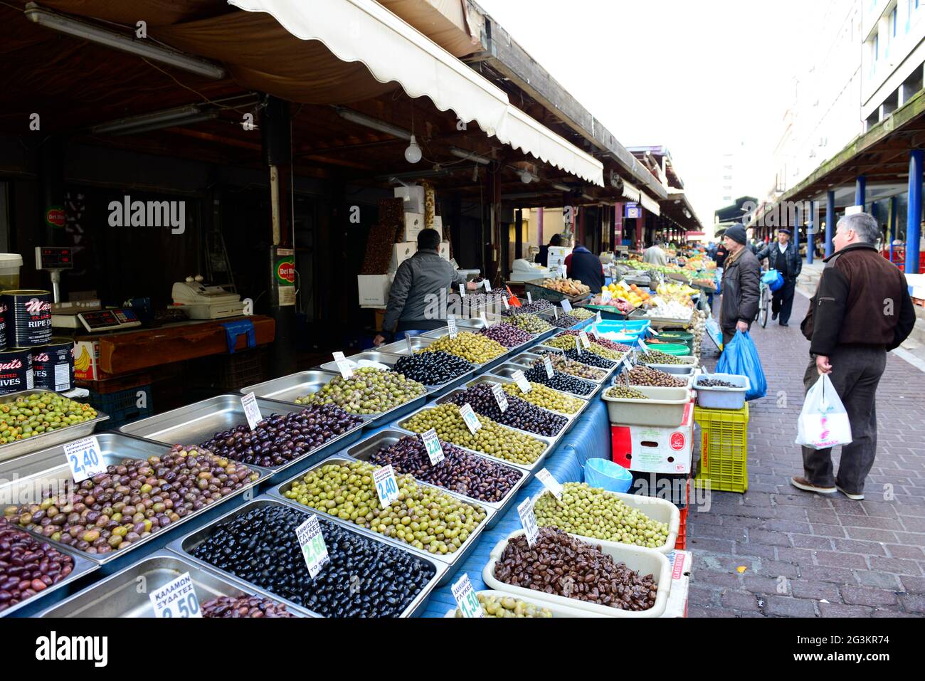 Greek olives vendor at the central market in Athens, Greece Stock Photo ...