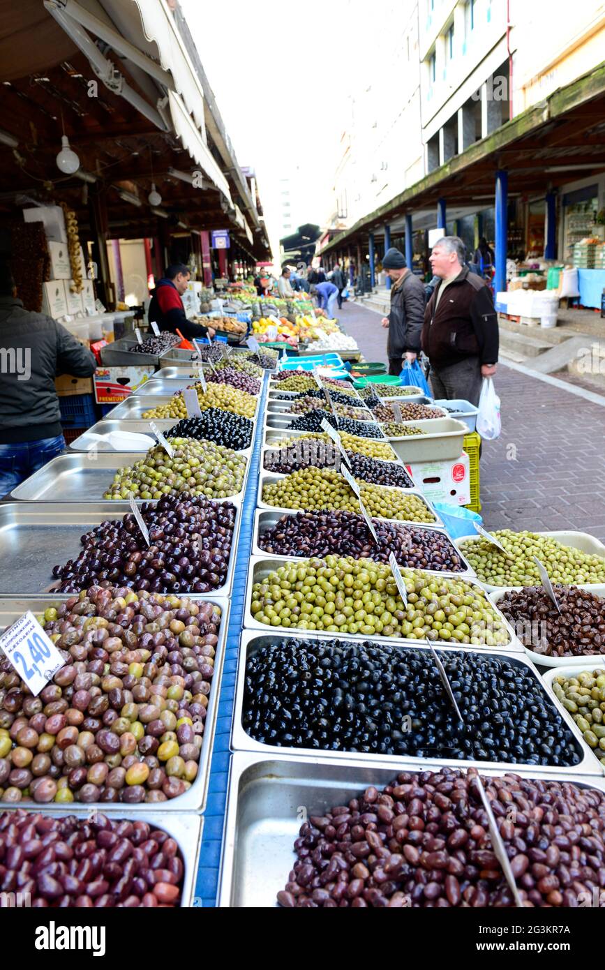 Greek olives vendor at the central market in Athens, Greece Stock Photo ...