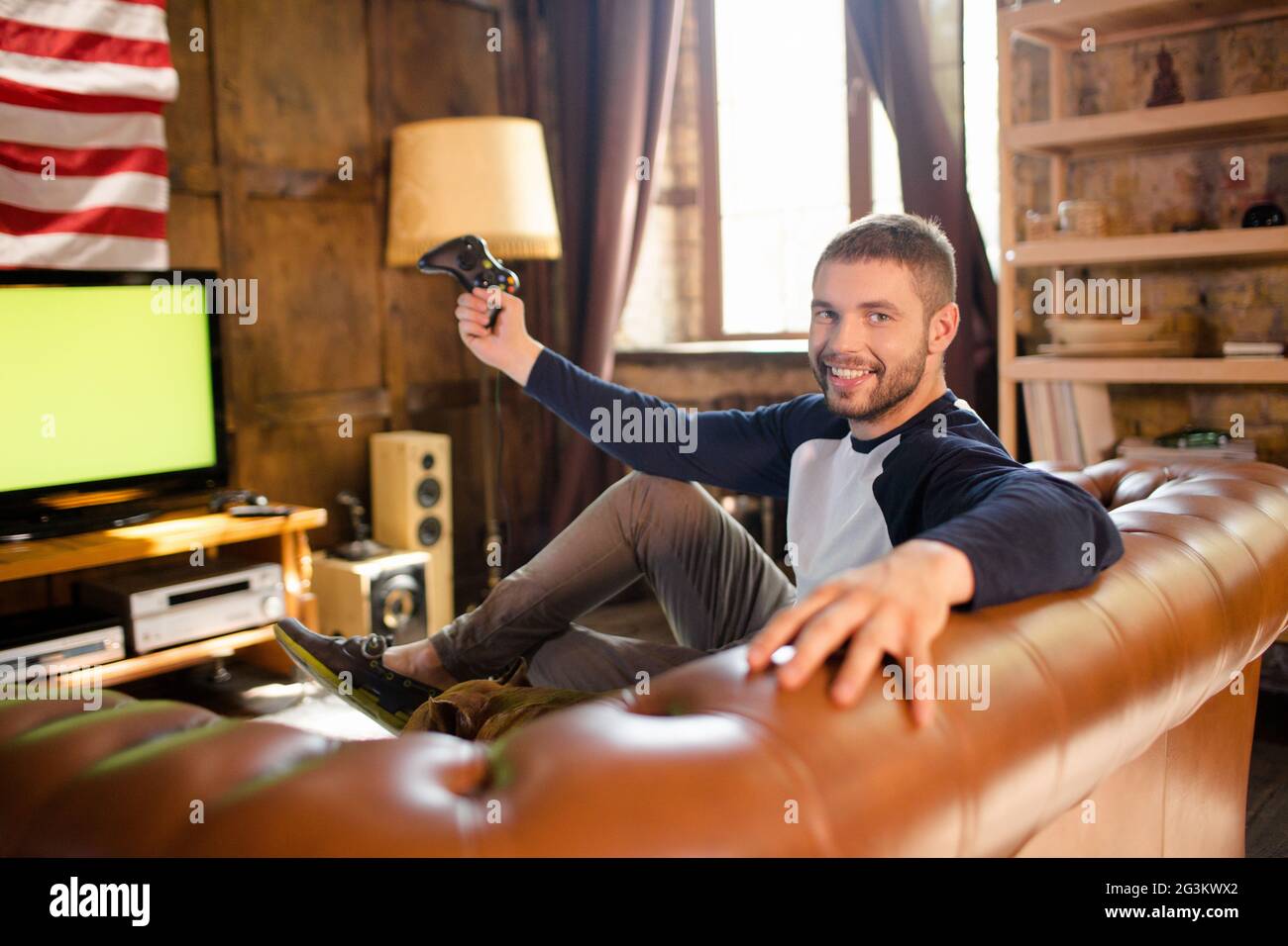 Man sitting couch hi-res stock photography and images - Alamy
