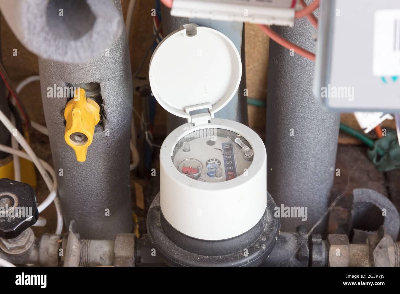 Meter and connection on city block heating Stock Photo Alamy