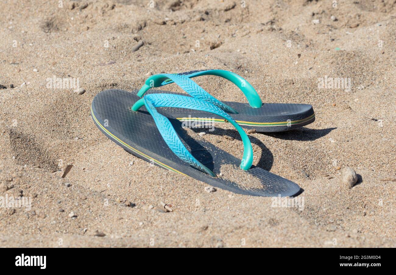 Blue and green flip flops Stock Photo - Alamy