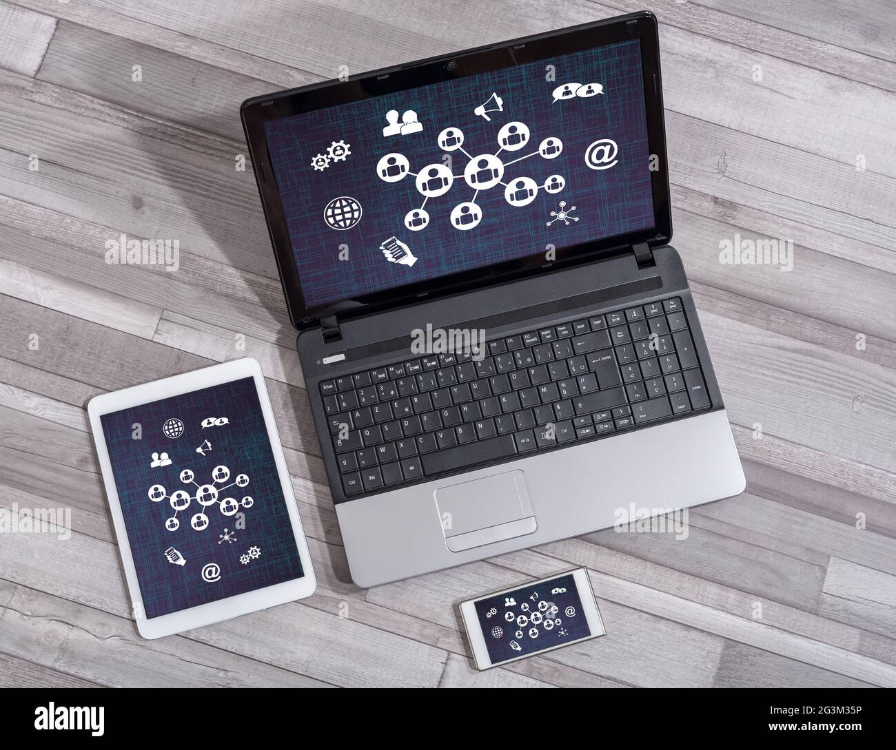 Social network concept shown on different information technology devices Stock Photo