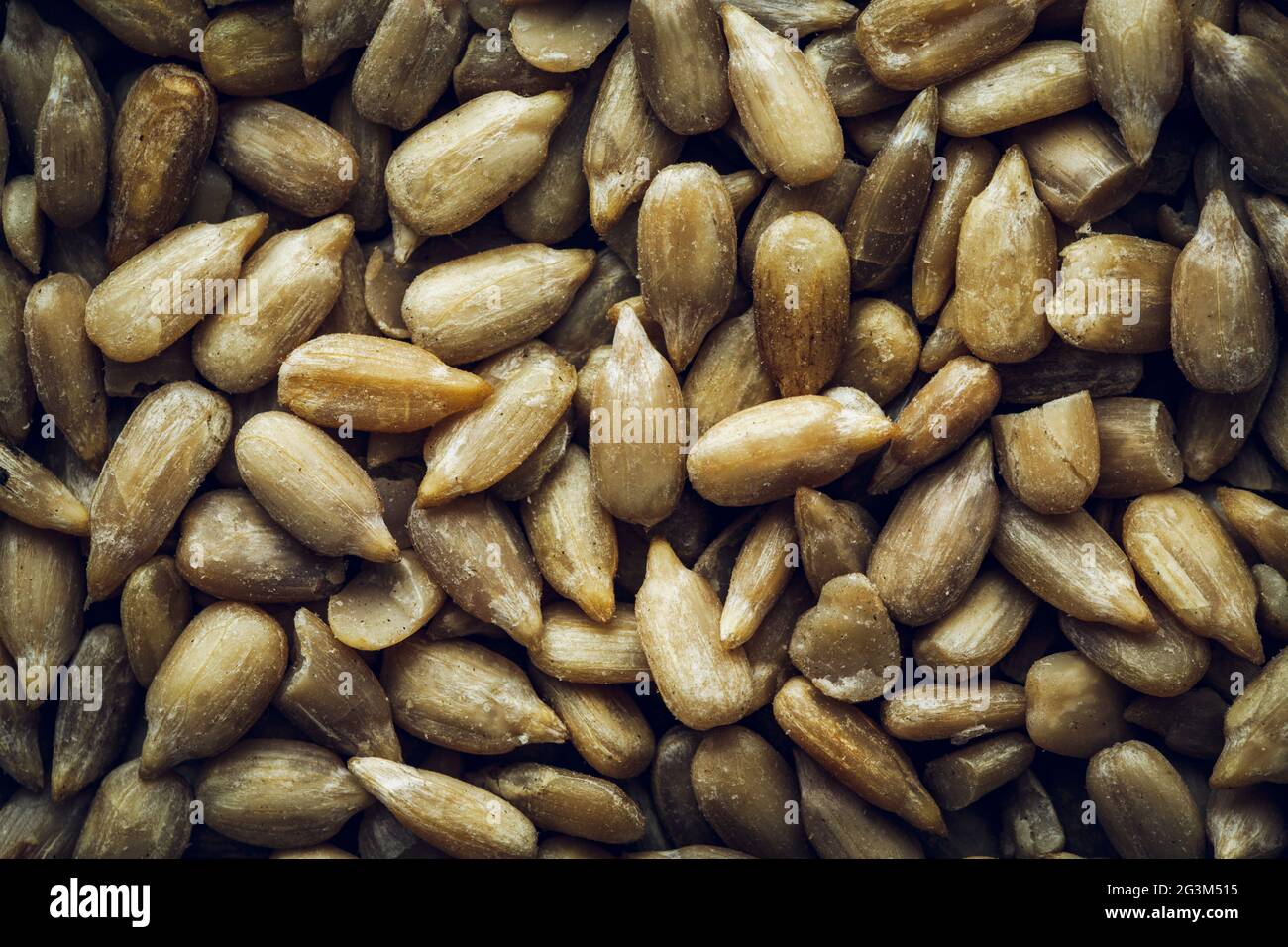 Peeled sunflower seeds macro background Stock Photo - Alamy