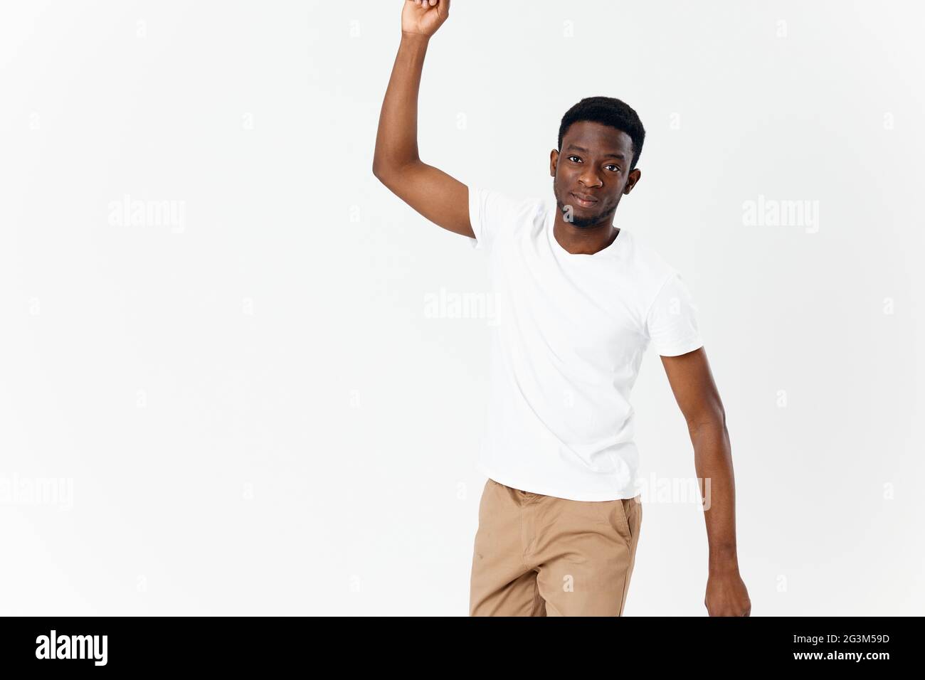 Man In White T-shirt Gesturing With Hands Casual Wear Studio Stock Photo