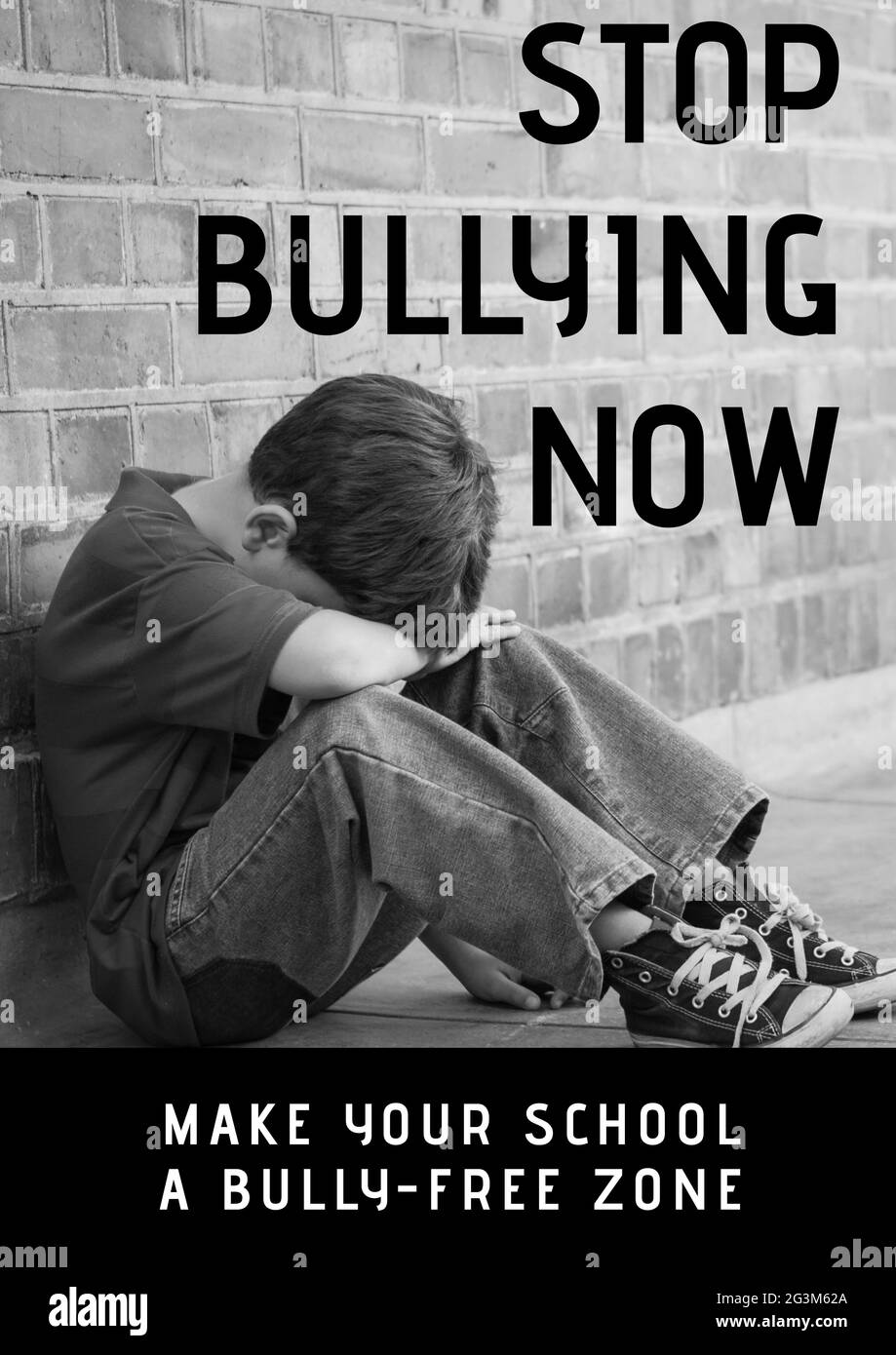 Composition of anti bullying text with crying schoolboy in black and white Stock Photo