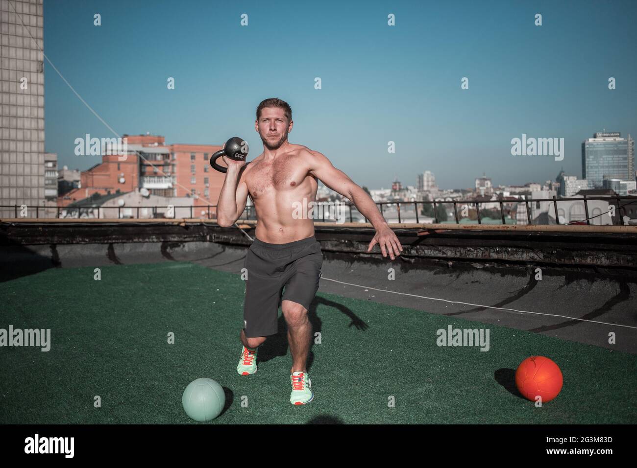 Man practicing crossfit exercises with weight. Stock Photo