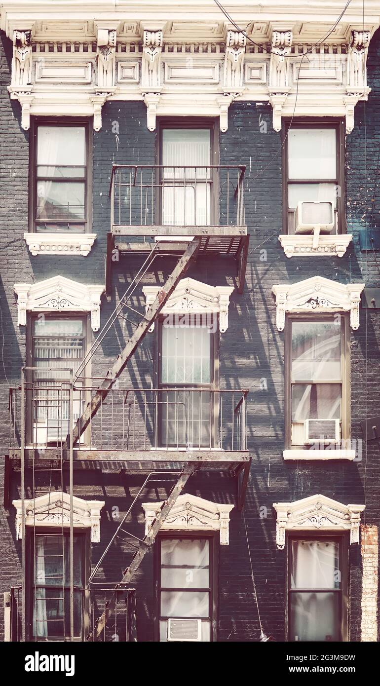 New York old townhouse with fire escape, color toning applied, USA. Stock Photo