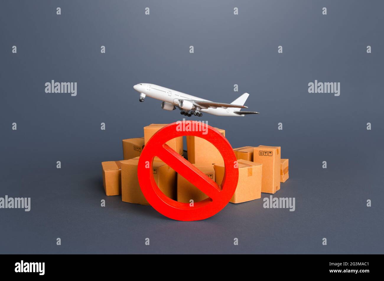 Cargo plane, boxes and red prohibition symbol NO. Embargo, a ban on commercial aircraft. Sanctions. Restrictions on export of strategically important Stock Photo