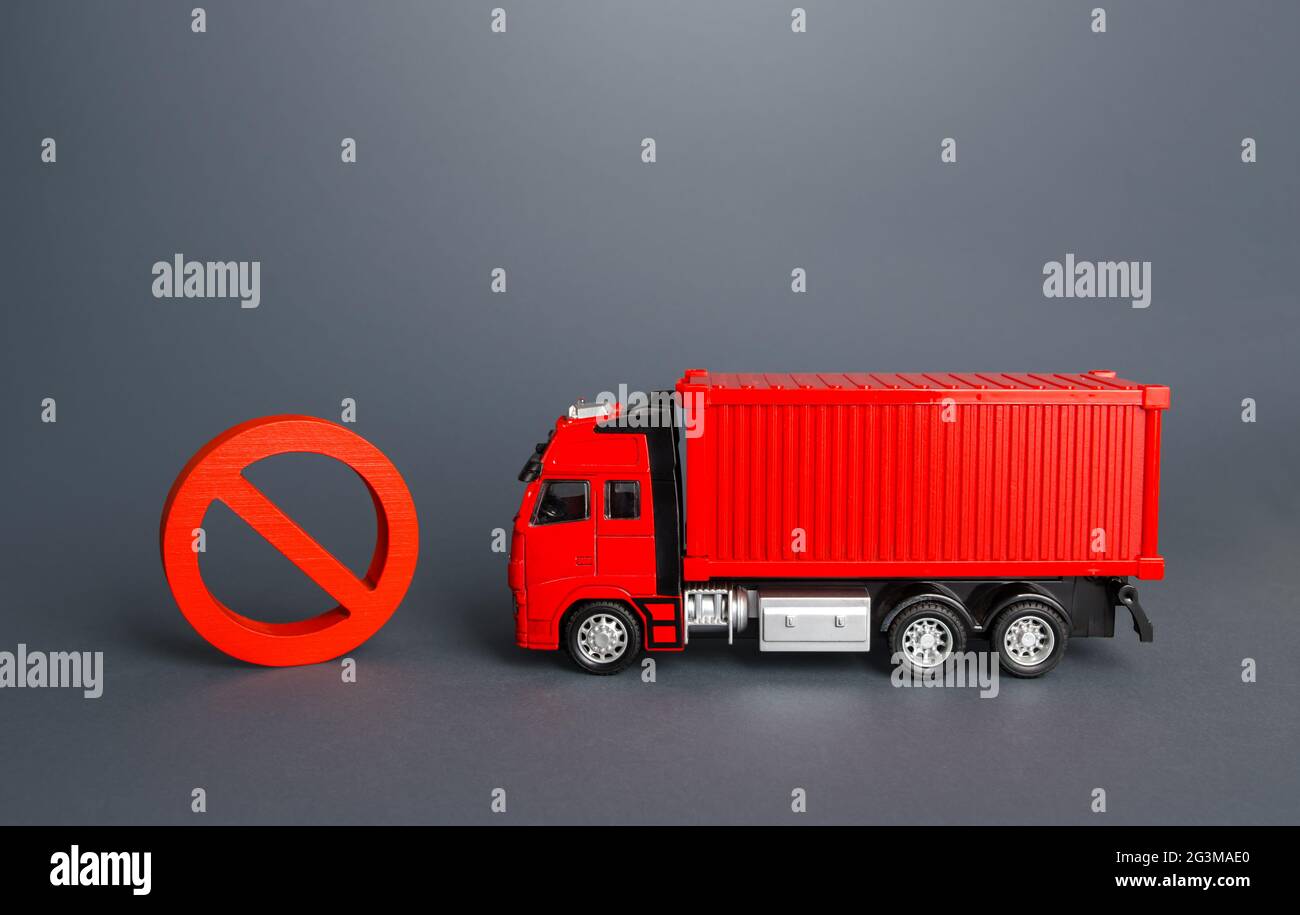 Freight truck and prohibition sign no. Restrictions on import and export. Ban on transfer of goods, trade wars. Sanctions economic pressure. Inaccessi Stock Photo