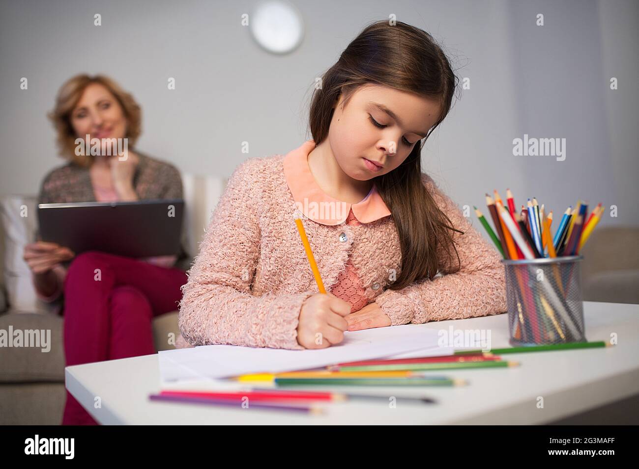 Little girl drawing with pencils Stock Photo - Alamy