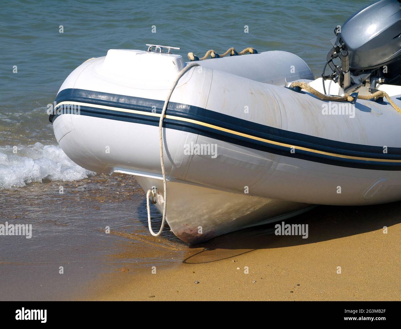 inflatable boat with motor on a beach Stock Photo - Alamy, image size:1300x1065