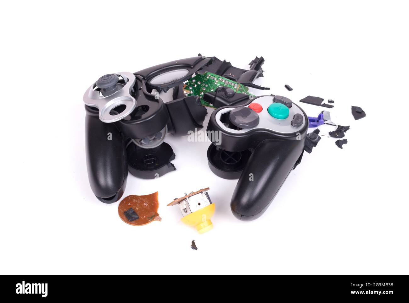 Broken video game controller on white background Stock Photo - Alamy
