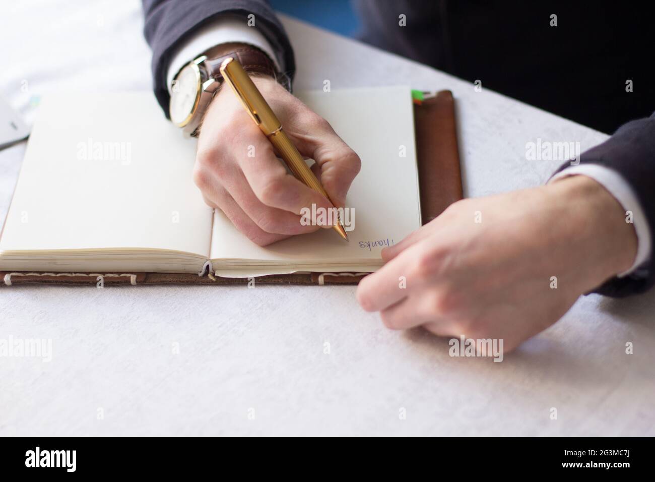 Businessman making notes on the paper Stock Photo