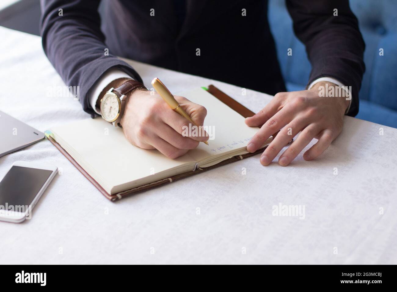 Businessman making notes on the paper Stock Photo