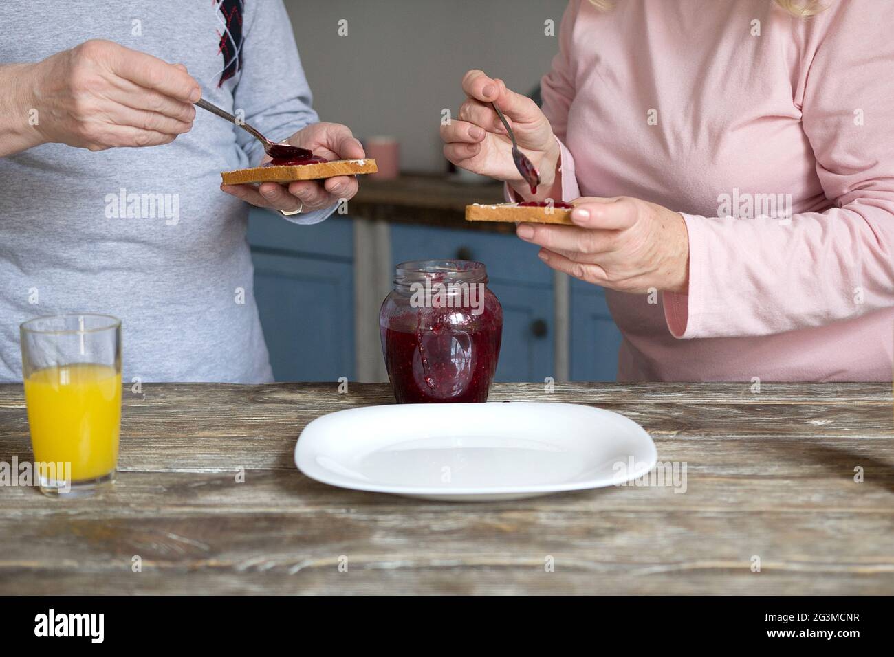 Elderly couple having breakfast. Stock Photo