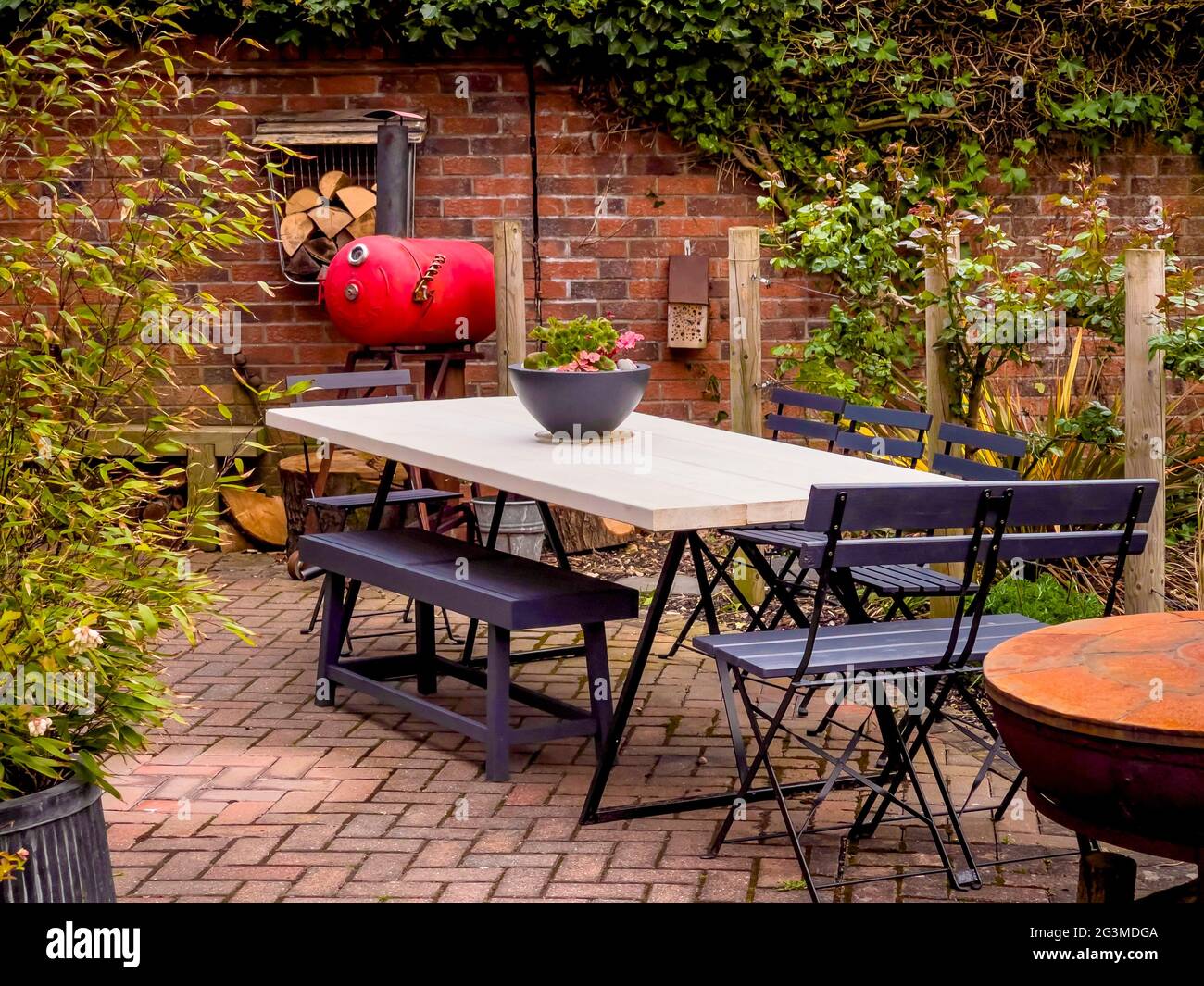 Outdoor patio area with large table and chairs Stock Photo