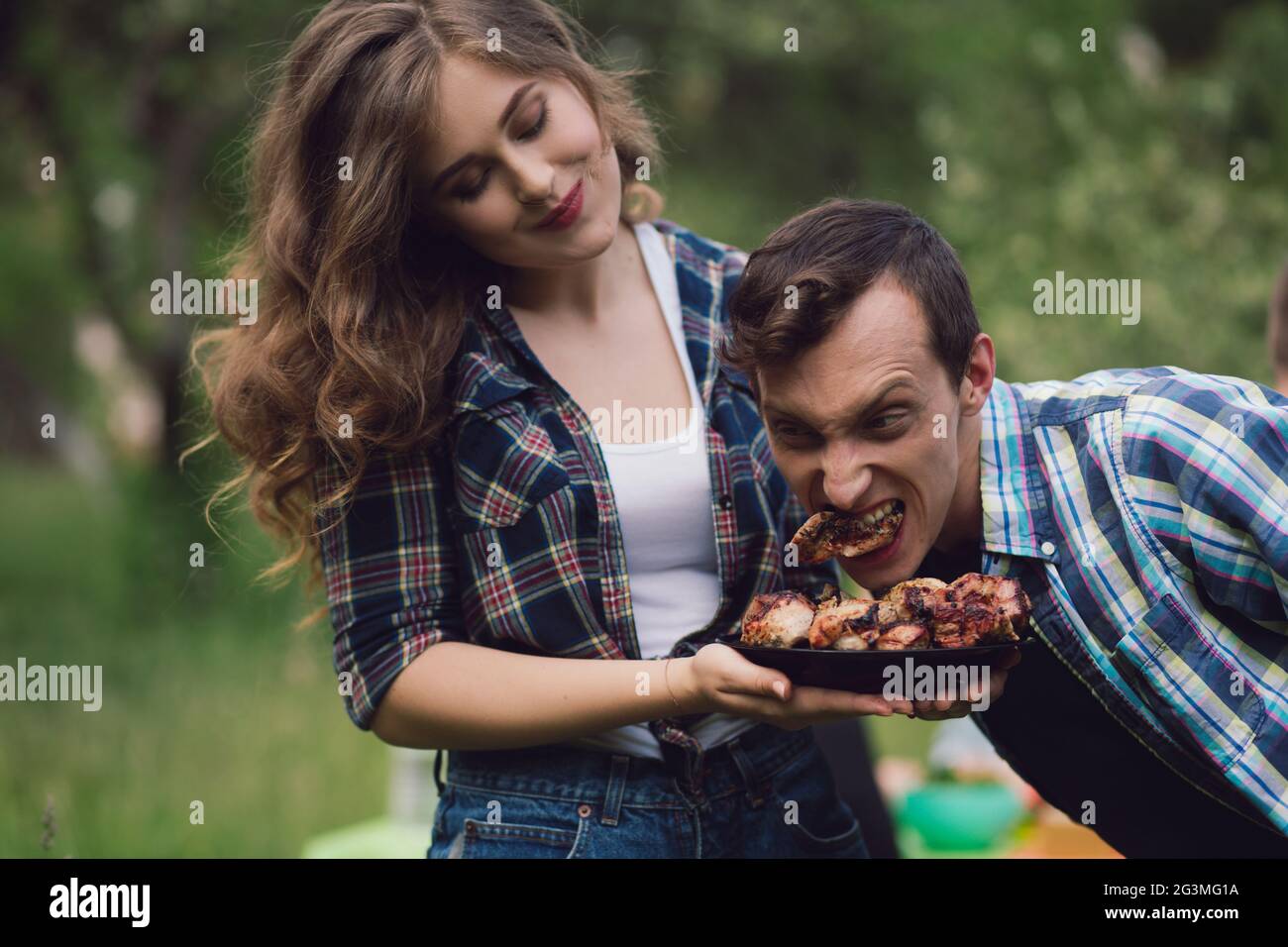 Funny couple out on picnic Stock Photo Alamy
