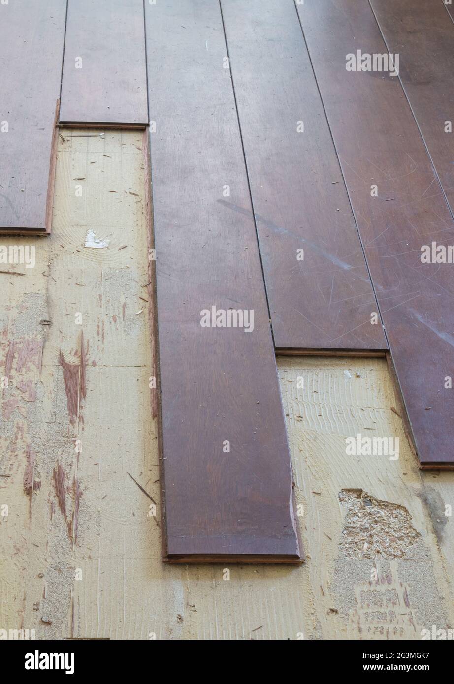 Breaking up a solid wooden floor Stock Photo Alamy