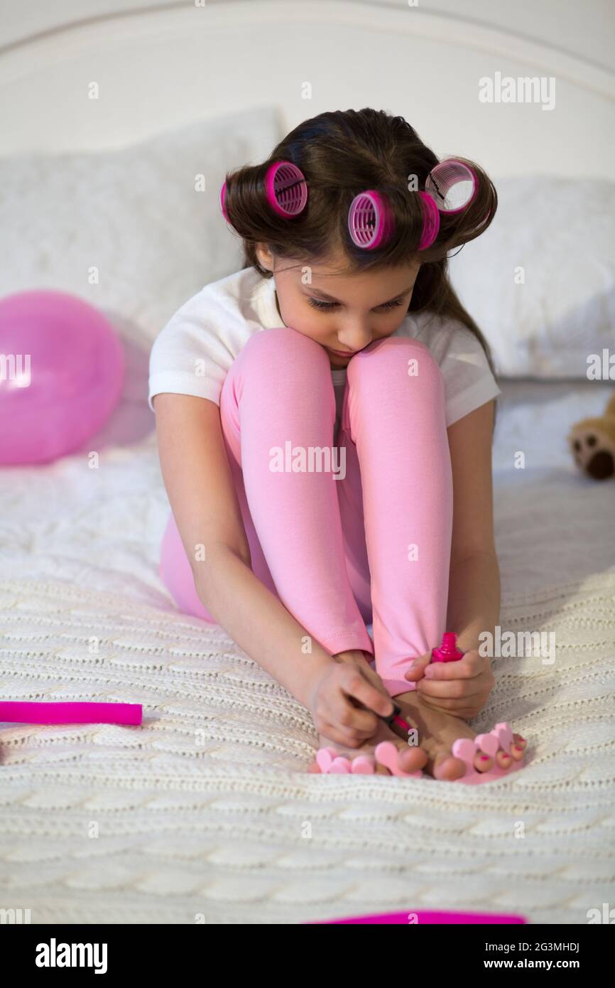 Little girl doing her pedicure. Stock Photo