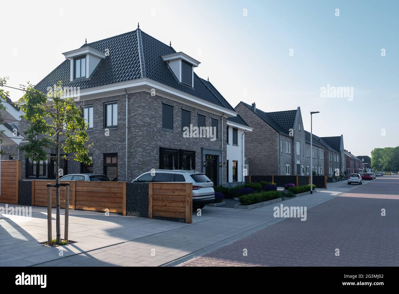 Dutch Suburban area with modern family houses, newly build modern family homes in the Netherlands, dutch family house, apartment house. Netherlands Stock Photo