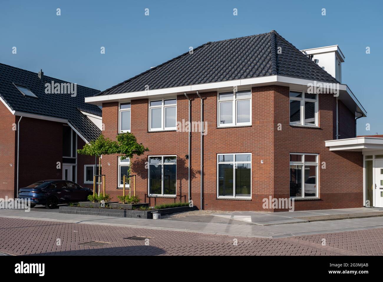 Dutch Suburban area with modern family houses, newly build modern family homes in the Netherlands, dutch family house, apartment house. Netherlands Stock Photo