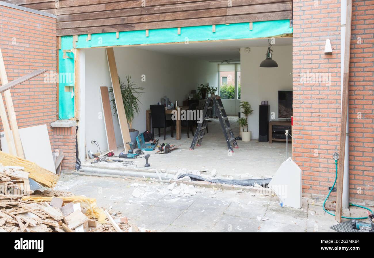 Removing a wall and placing a glass sliding door Stock Photo Alamy